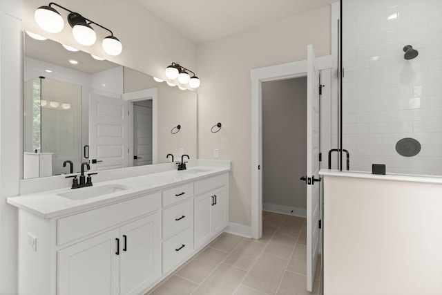 1577 Periwinkle Dr, Mount Pleasant, SC 29466 - bathroom featuring a shower stall, double vanity, tile patterned floors, and baseboards