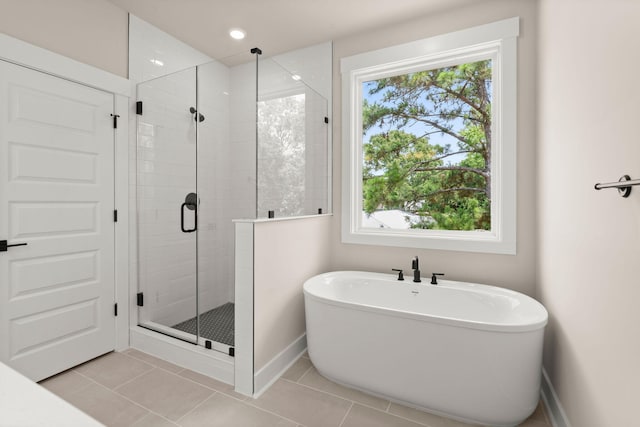 1577 Periwinkle Dr, Mount Pleasant, SC 29466 - full bath featuring a freestanding tub, a stall shower, plenty of natural light, and baseboards