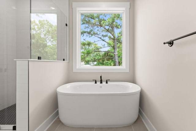 1577 Periwinkle Dr, Mount Pleasant, SC 29466 - full bath with a freestanding tub, a walk in shower, baseboards, and tile patterned flooring