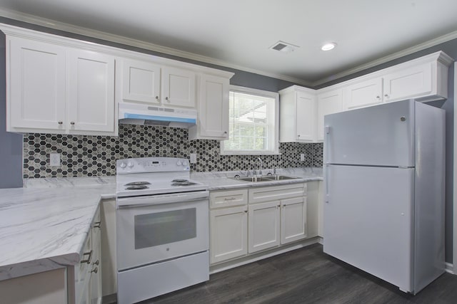 227 Grace St, Walterboro, SC 29488 - kitchen featuring white appliances, under cabinet range hood, white cabinets, ornamental molding, and dark wood-style flooring