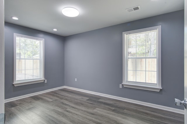 227 Grace St, Walterboro, SC 29488 - empty room with dark wood-type flooring, plenty of natural light, and recessed lighting