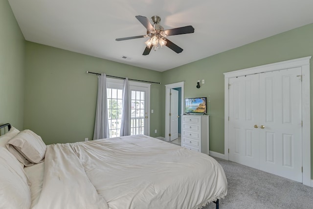 carpeted bedroom featuring a ceiling fan and baseboards