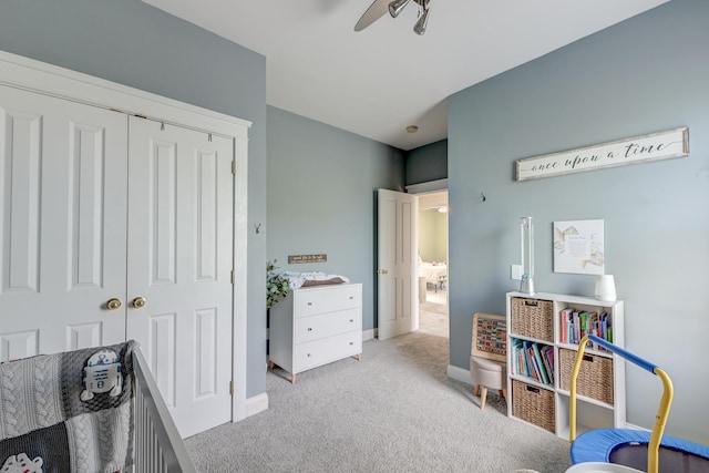 bedroom featuring carpet, a closet, and baseboards