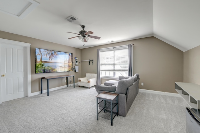 sitting room with light colored carpet, ceiling fan, baseboards, and vaulted ceiling