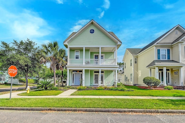 view of front of property with a porch and a front lawn
