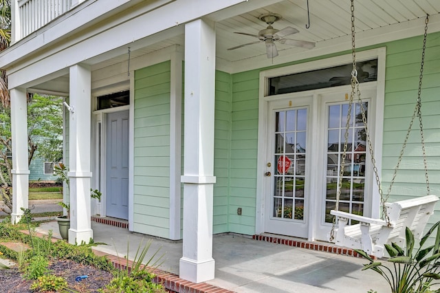 property entrance featuring a porch and ceiling fan