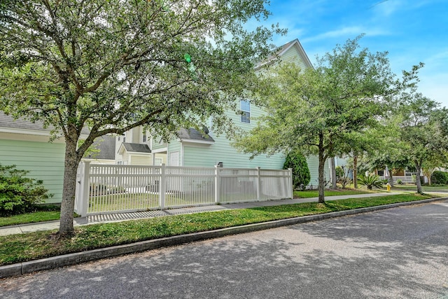 view of side of property with a fenced front yard
