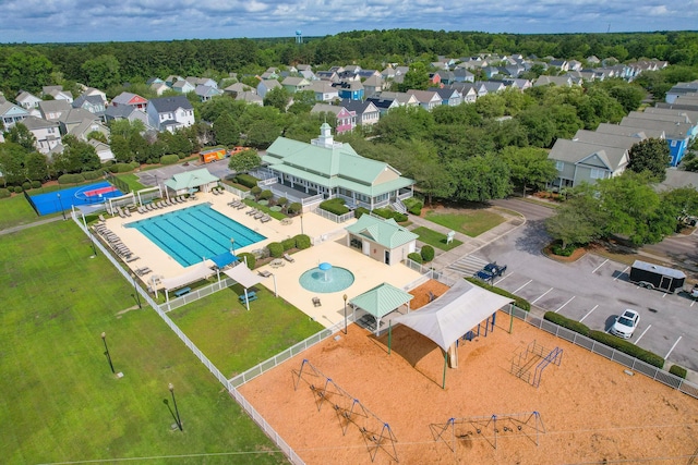 aerial perspective of suburban area with a pool area