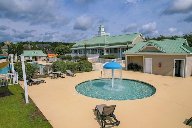 view of pool with fence, a gazebo, and a patio area
