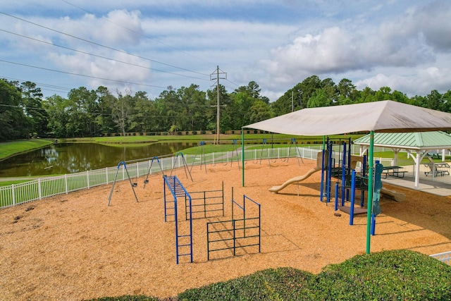 surrounding community featuring fence, a water view, view of scattered trees, and a gazebo
