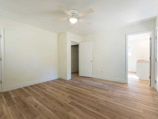 unfurnished bedroom with connected bathroom, ceiling fan, and light hardwood / wood-style flooring