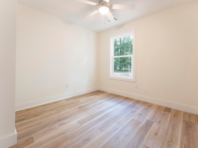 unfurnished room with ceiling fan and light wood-type flooring