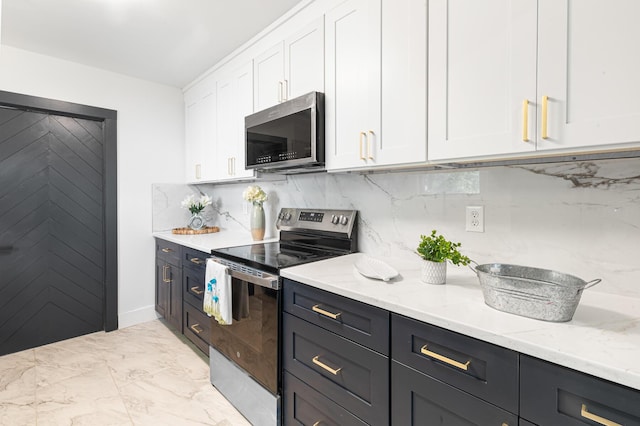 1129 Dickson Ave, Hanahan, SC 29410 - kitchen with stainless steel appliances, white cabinetry, light stone countertops, tasteful backsplash, and light marble finish floors