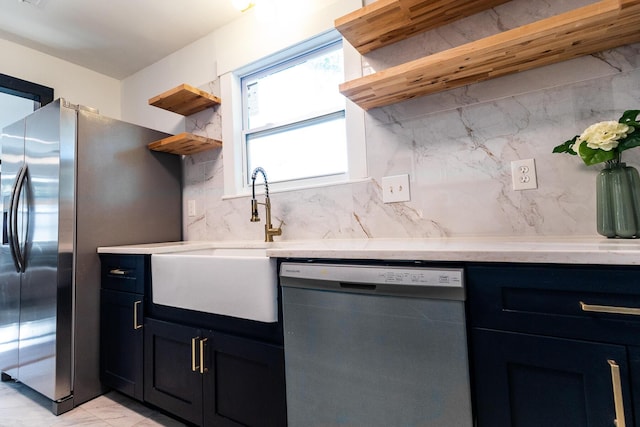 1129 Dickson Ave, Hanahan, SC 29410 - kitchen featuring appliances with stainless steel finishes, open shelves, tasteful backsplash, light marble finish floors, and dark cabinetry