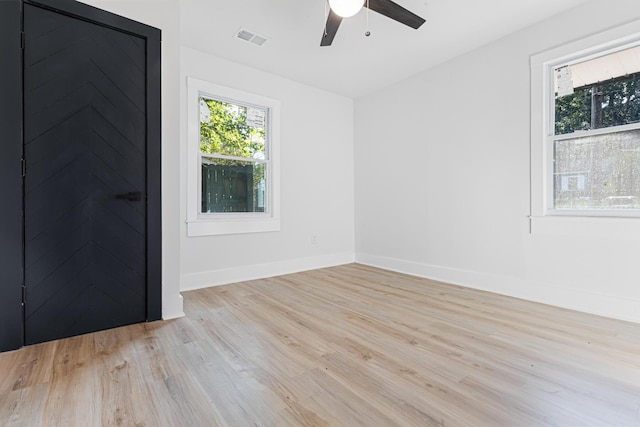 1129 Dickson Ave, Hanahan, SC 29410 - empty room featuring light wood-style flooring and ceiling fan