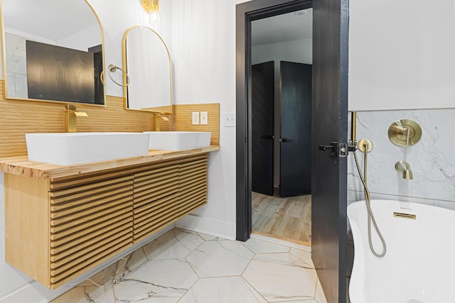 1129 Dickson Ave, Hanahan, SC 29410 - full bathroom featuring a freestanding tub and double vanity