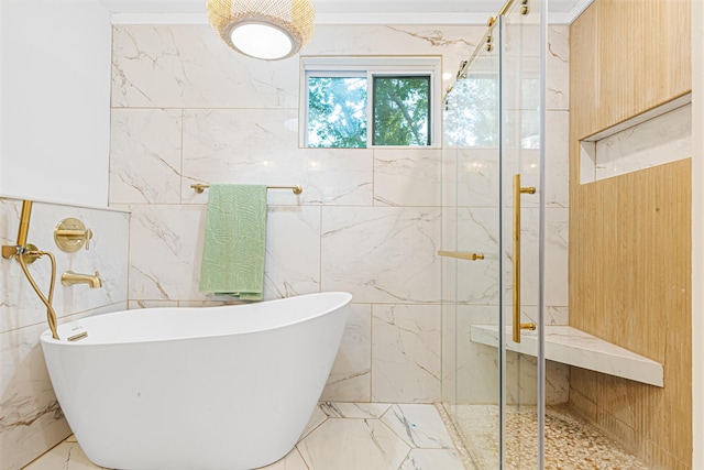 1129 Dickson Ave, Hanahan, SC 29410 - full bath featuring marble tiled floors, a freestanding bath, a marble finish shower, and tile walls