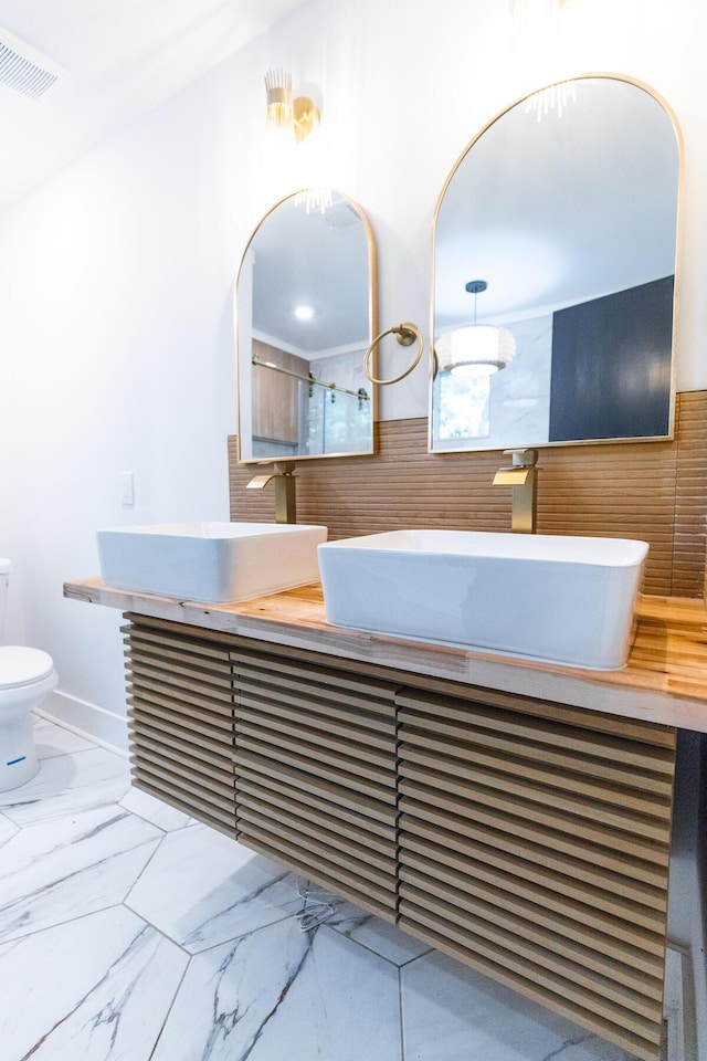 1129 Dickson Ave, Hanahan, SC 29410 - full bath featuring double vanity and marble look tile flooring
