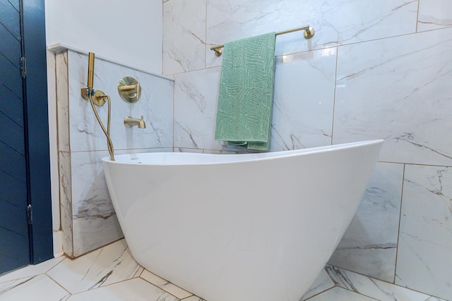 1129 Dickson Ave, Hanahan, SC 29410 - bathroom featuring a freestanding tub and marble tiled floors