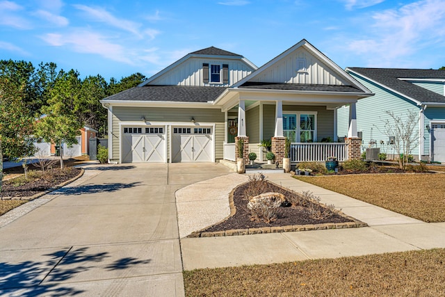 craftsman-style home featuring a porch and a garage