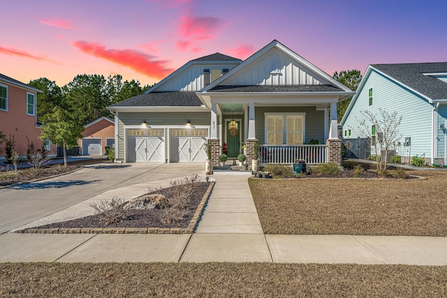 craftsman-style house featuring a porch and a garage