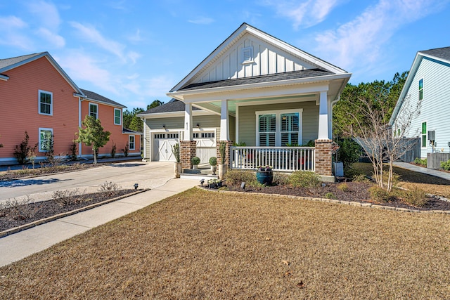 view of front of property featuring a porch, a garage, a front lawn, and central air condition unit