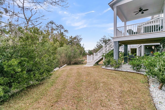 view of yard with ceiling fan