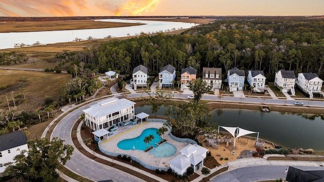 aerial view at dusk with a water view