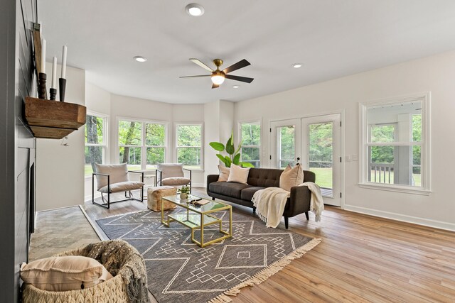 5950 Kelseys Mill Rd, Ravenel, SC 29470 - living area with wood finished floors, ceiling fan, recessed lighting, and a healthy amount of sunlight
