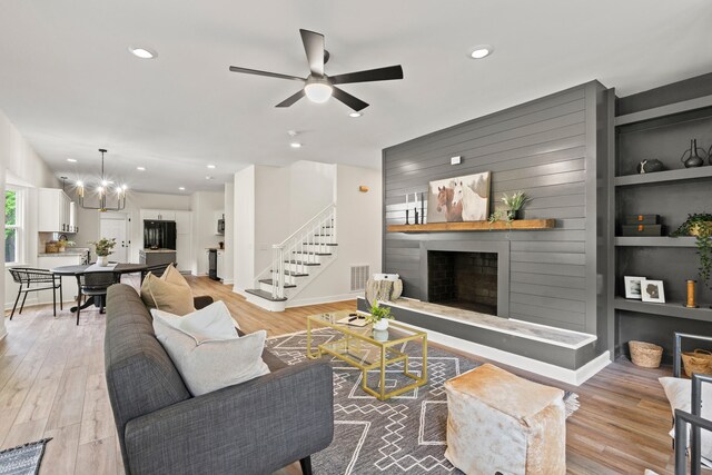 5950 Kelseys Mill Rd, Ravenel, SC 29470 - living room featuring wood finished floors, a fireplace, visible vents, and recessed lighting