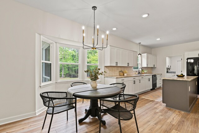 5950 Kelseys Mill Rd, Ravenel, SC 29470 - dining area featuring baseboards, recessed lighting, an inviting chandelier, and light wood-style floors