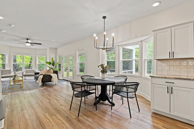 5950 Kelseys Mill Rd, Ravenel, SC 29470 - dining room featuring french doors, recessed lighting, light wood-style floors, and ceiling fan with notable chandelier