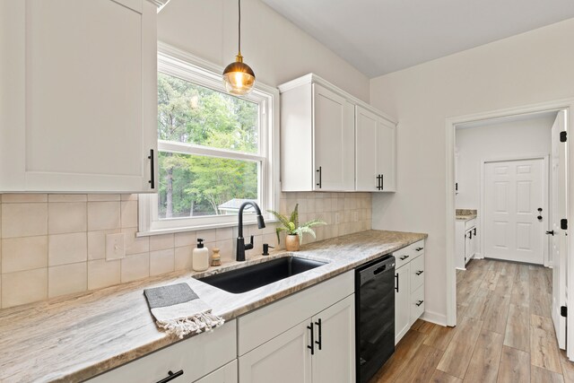 5950 Kelseys Mill Rd, Ravenel, SC 29470 - kitchen with decorative light fixtures, dishwasher, a sink, white cabinetry, and light wood finished floors