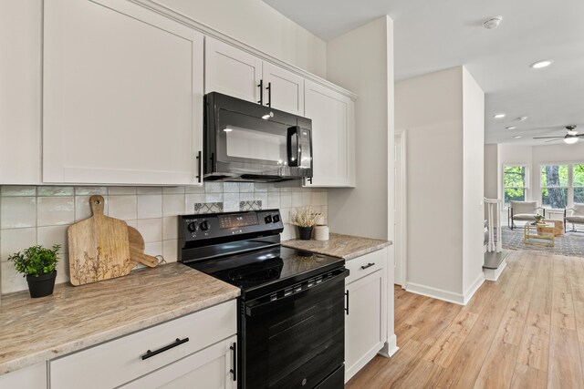 5950 Kelseys Mill Rd, Ravenel, SC 29470 - kitchen with light wood-style flooring, white cabinetry, a ceiling fan, black appliances, and recessed lighting