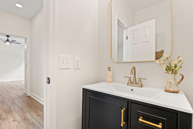 5950 Kelseys Mill Rd, Ravenel, SC 29470 - bathroom with wood finished floors, vanity, baseboards, and a ceiling fan
