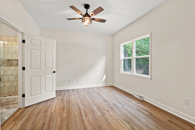5950 Kelseys Mill Rd, Ravenel, SC 29470 - empty room featuring light wood-style flooring, baseboards, a ceiling fan, and visible vents