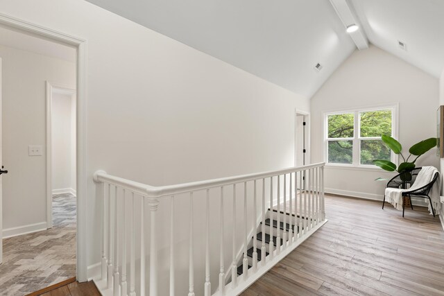 5950 Kelseys Mill Rd, Ravenel, SC 29470 - hallway with visible vents, an upstairs landing, wood finished floors, and lofted ceiling with beams