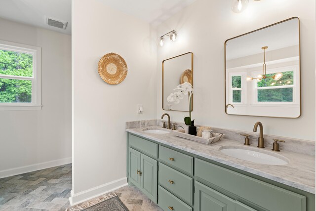 5950 Kelseys Mill Rd, Ravenel, SC 29470 - bathroom featuring visible vents, baseboards, and a sink