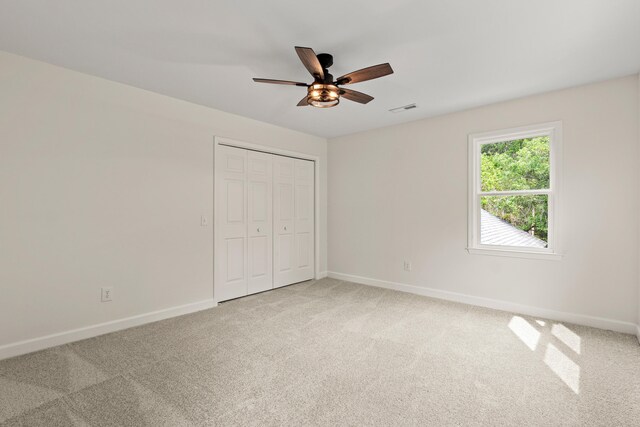 5950 Kelseys Mill Rd, Ravenel, SC 29470 - unfurnished bedroom with visible vents, a closet, baseboards, and light carpet