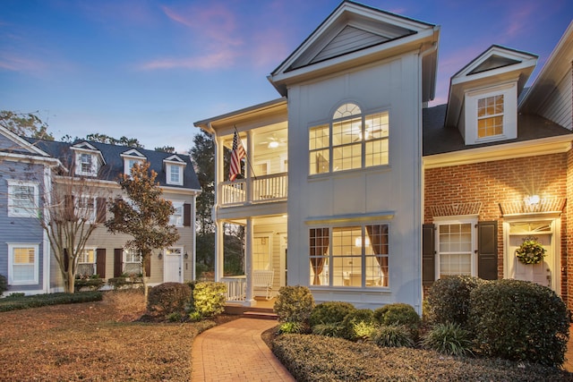 view of front of home with a balcony