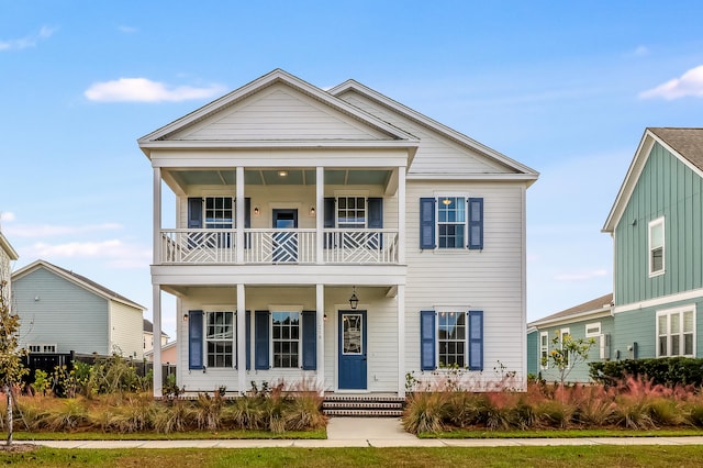 view of front of home featuring a balcony and covered porch