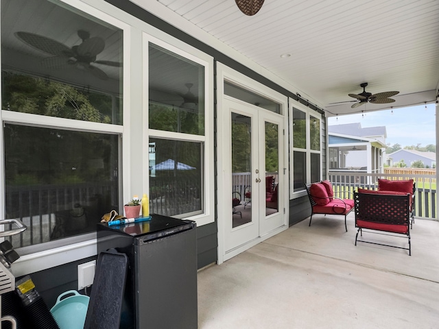 view of patio featuring ceiling fan and french doors