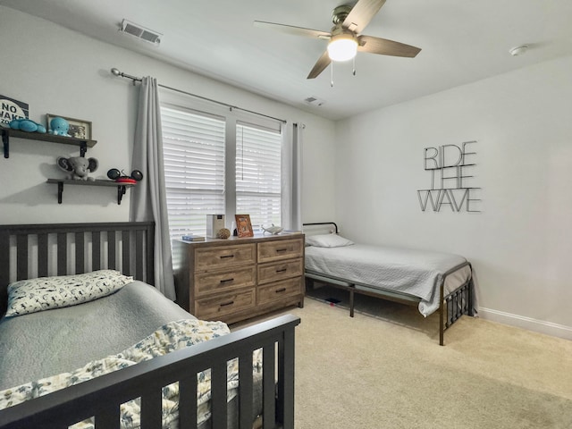 bedroom with ceiling fan and light colored carpet