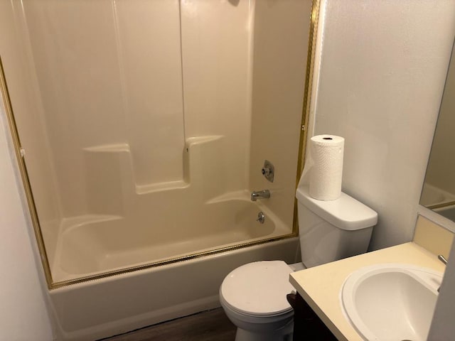 7713 Suzanne Dr, North Charleston, SC 29418 - bathroom with vanity, toilet, tub / shower combination, and wood finished floors