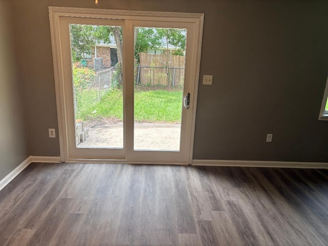 7713 Suzanne Dr, North Charleston, SC 29418 - doorway to outside featuring baseboards and wood finished floors