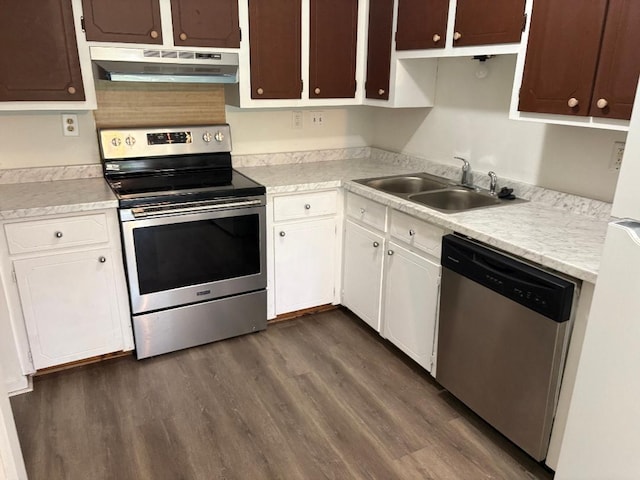 7713 Suzanne Dr, North Charleston, SC 29418 - kitchen with appliances with stainless steel finishes, extractor fan, a sink, dark wood-type flooring, and light countertops