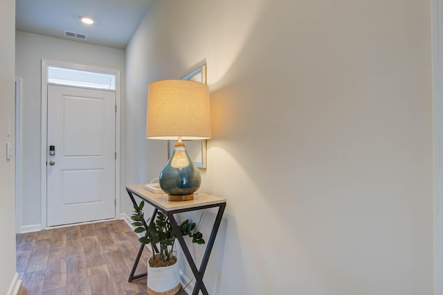 doorway to outside featuring wood finished floors and visible vents