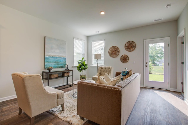 living room with dark wood-style floors, a wealth of natural light, baseboards, and recessed lighting