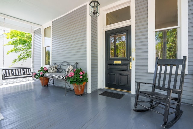 view of exterior entry with covered porch