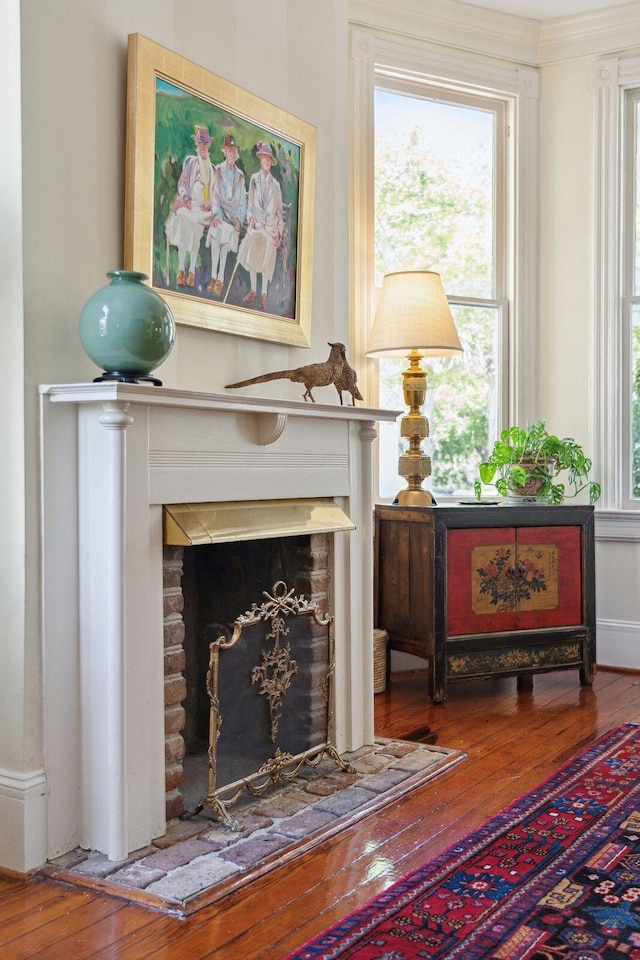 sitting room featuring a fireplace and wood-type flooring